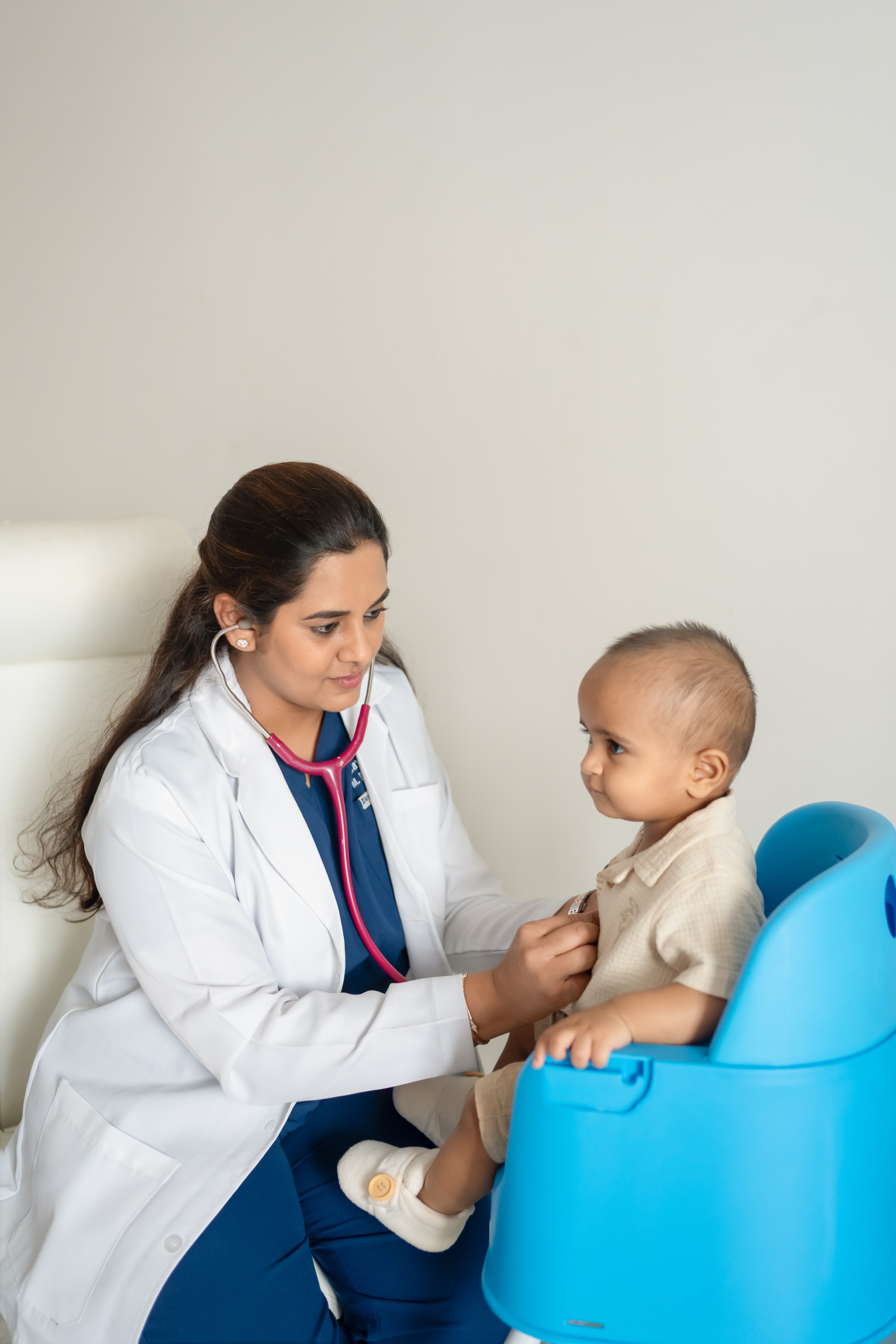 Dr. Gayathri Reddy examining a baby patient