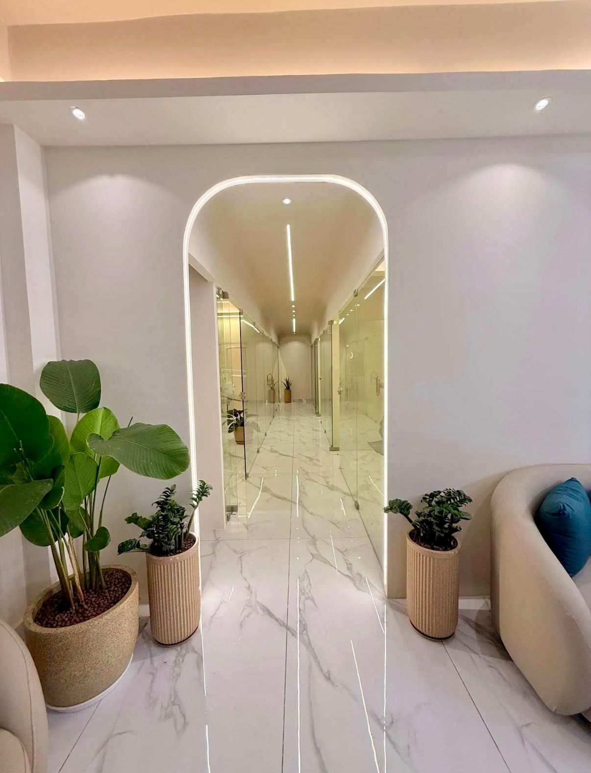 Clinic corridor with arch doorway and plants